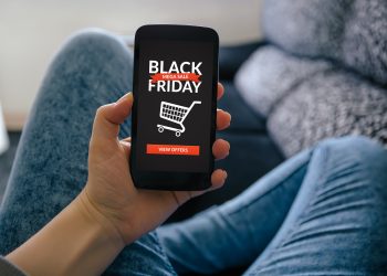 Girl holding smart phone with Black Friday concept on screen. All screen content is designed by me